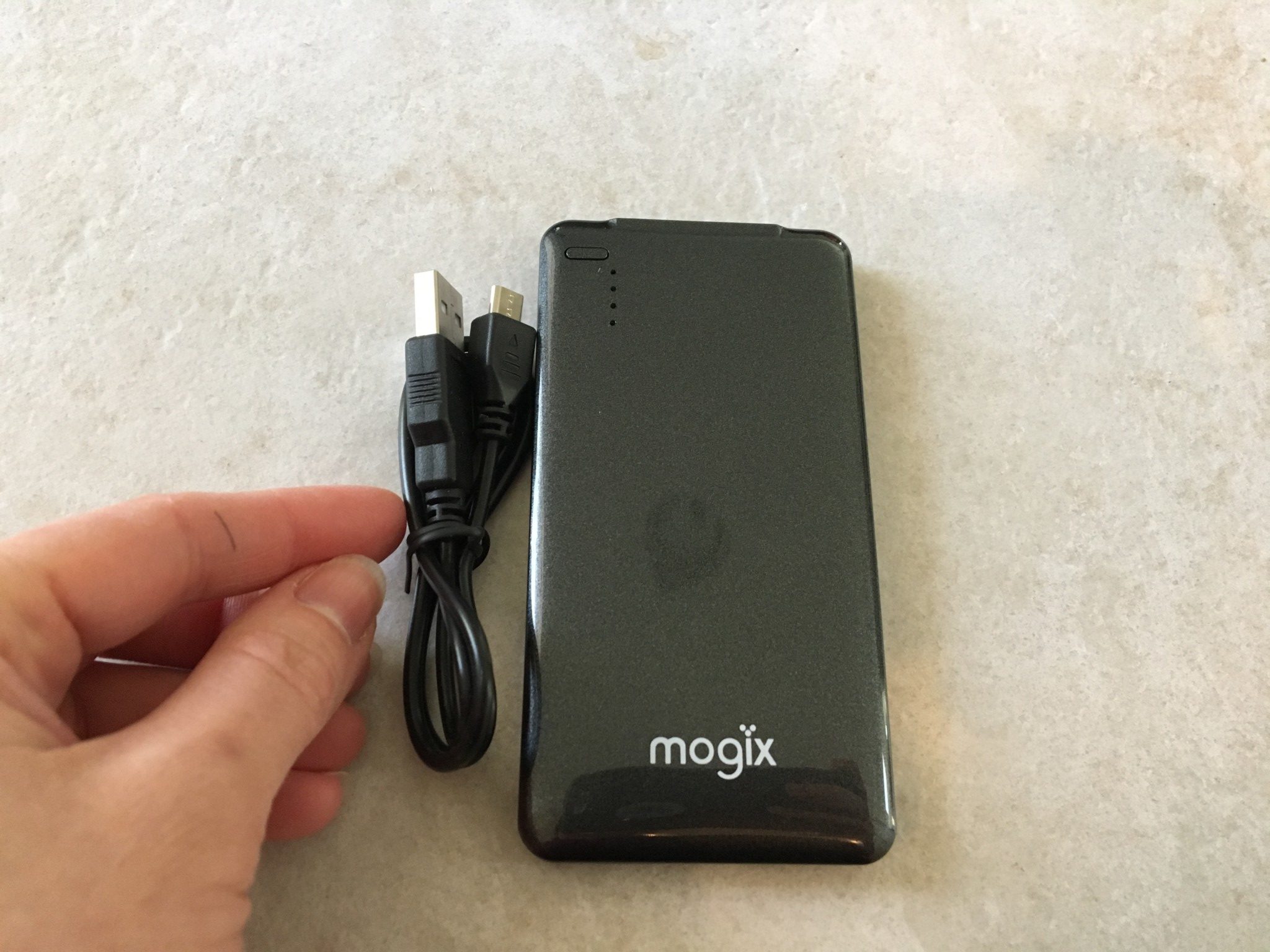 The Mogix Portable Charger and the included power cord to re-charge the Mogix